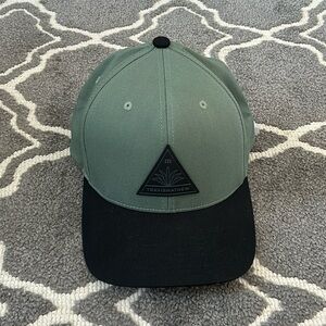 Travis Mathew snapback hat green black